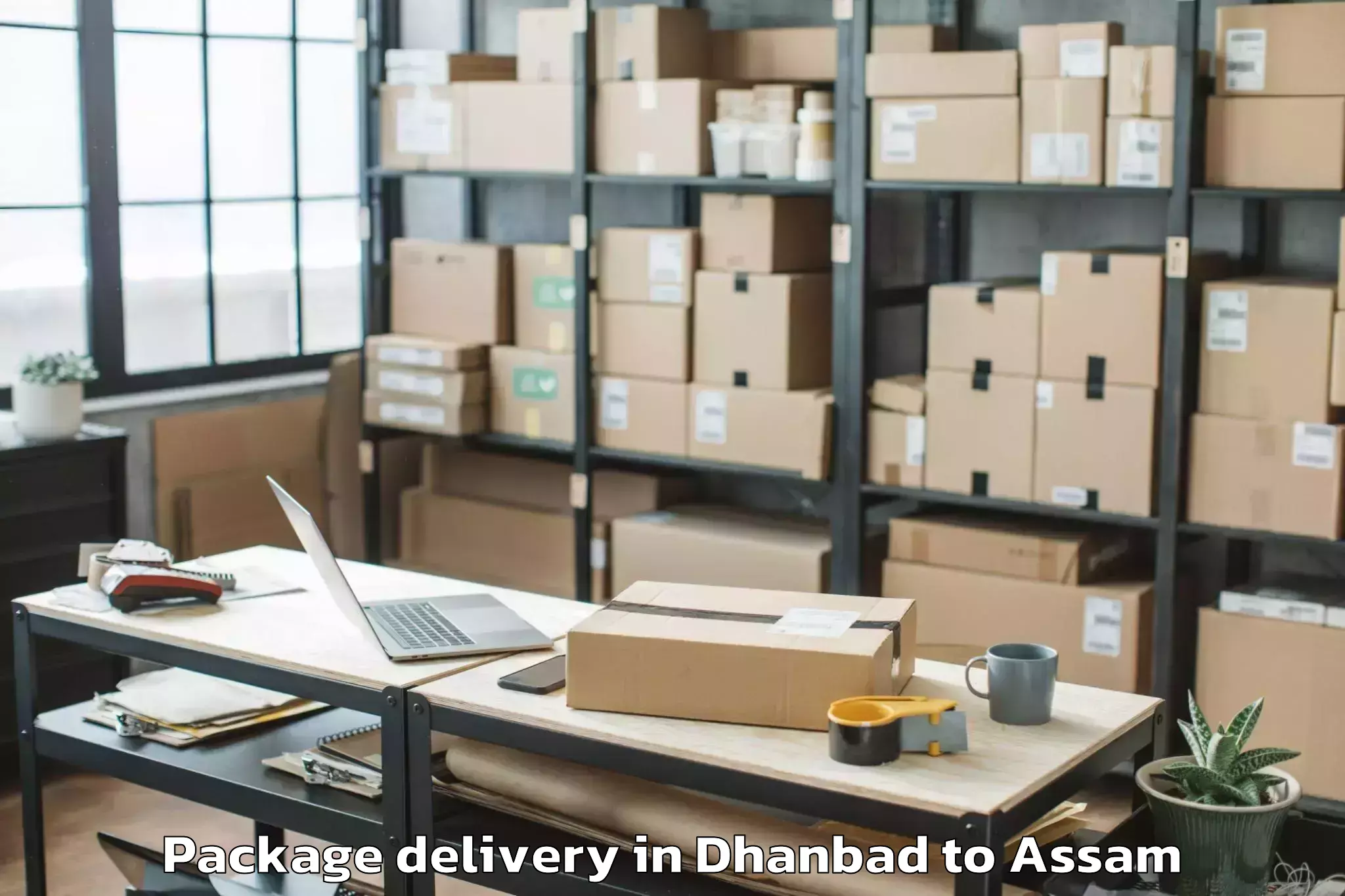 Trusted Dhanbad to Golakganj Package Delivery